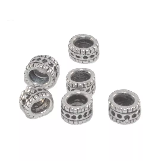 perles travaillé  5.20 mm de diam,trou  3 mm