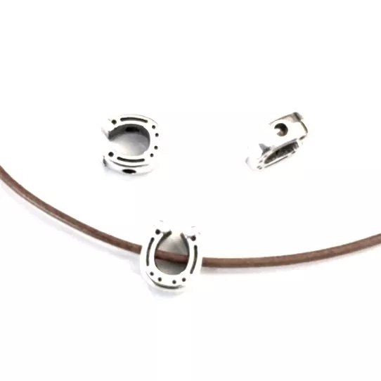 Fer à cheval traversant