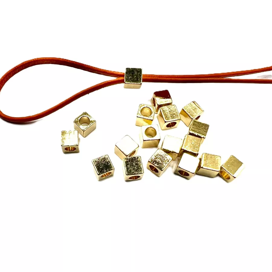 Cube en laiton plaqués en France - Or